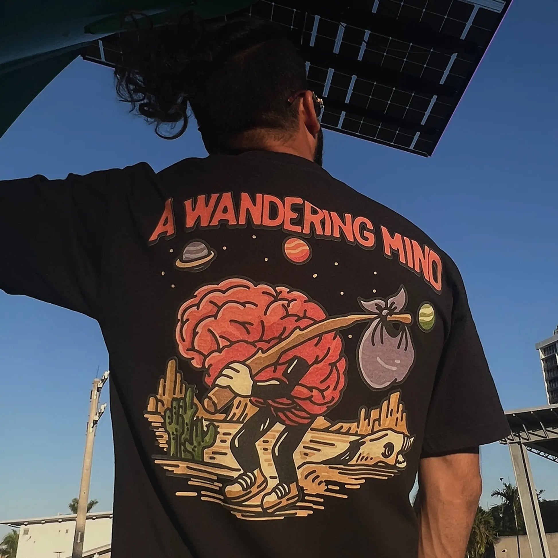 A Wandering Mind Arid Desert t-shirt in black back view worn on model