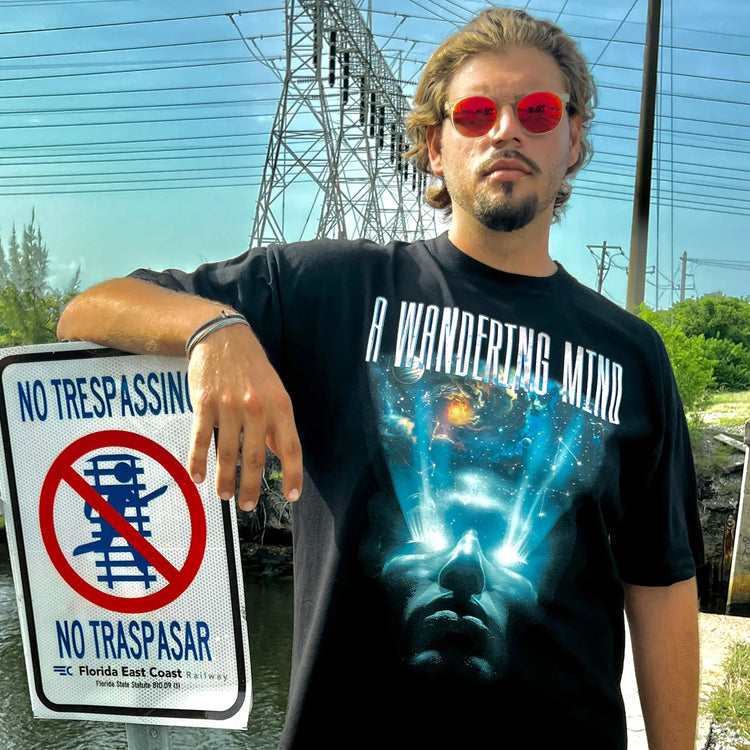 A Wandering Mind Awakening t-shirt in black front view worn on model