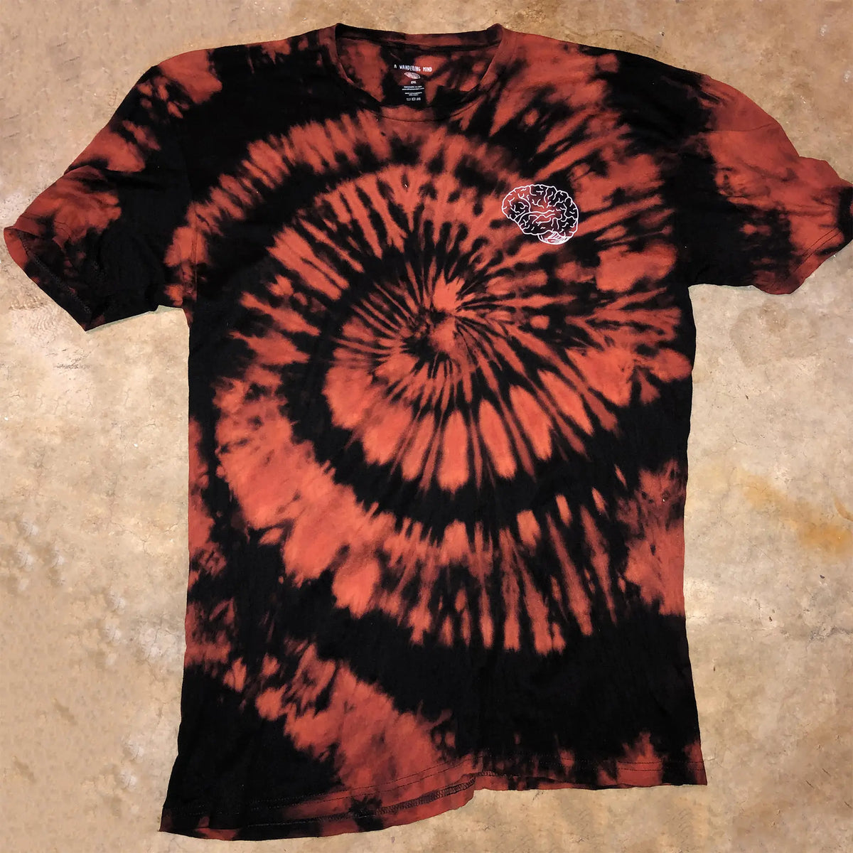 A Wandering Mind Classic Brain White Logo t-shirt in bleach-dyed black front view