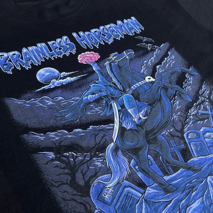 A Wandering Mind Brainless Horseman t-shirt in black front graphic detail showing headless rider, horse, brain, moon