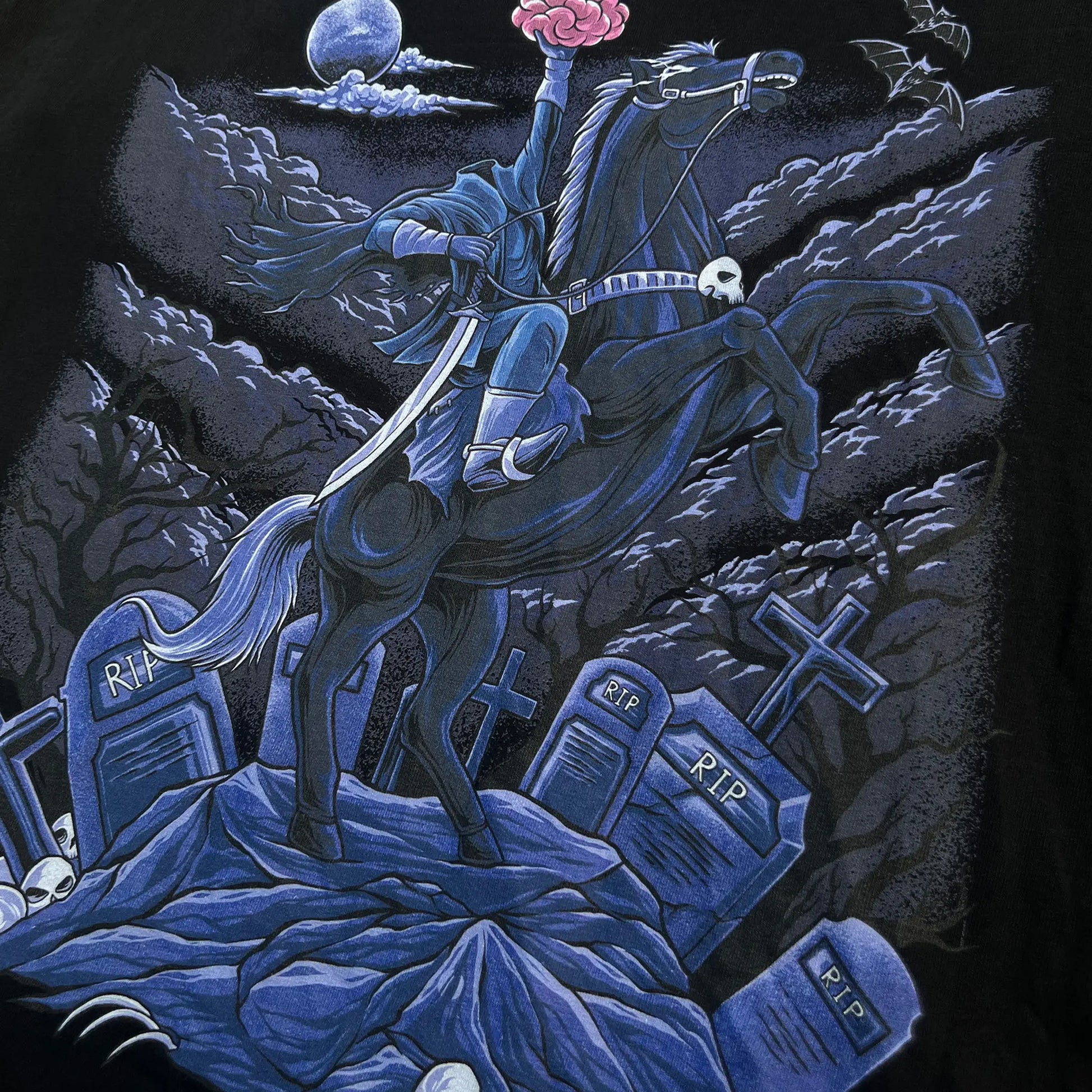 A Wandering Mind Brainless Horseman t-shirt in black front graphic featuring headless rider, horse, brain, moon