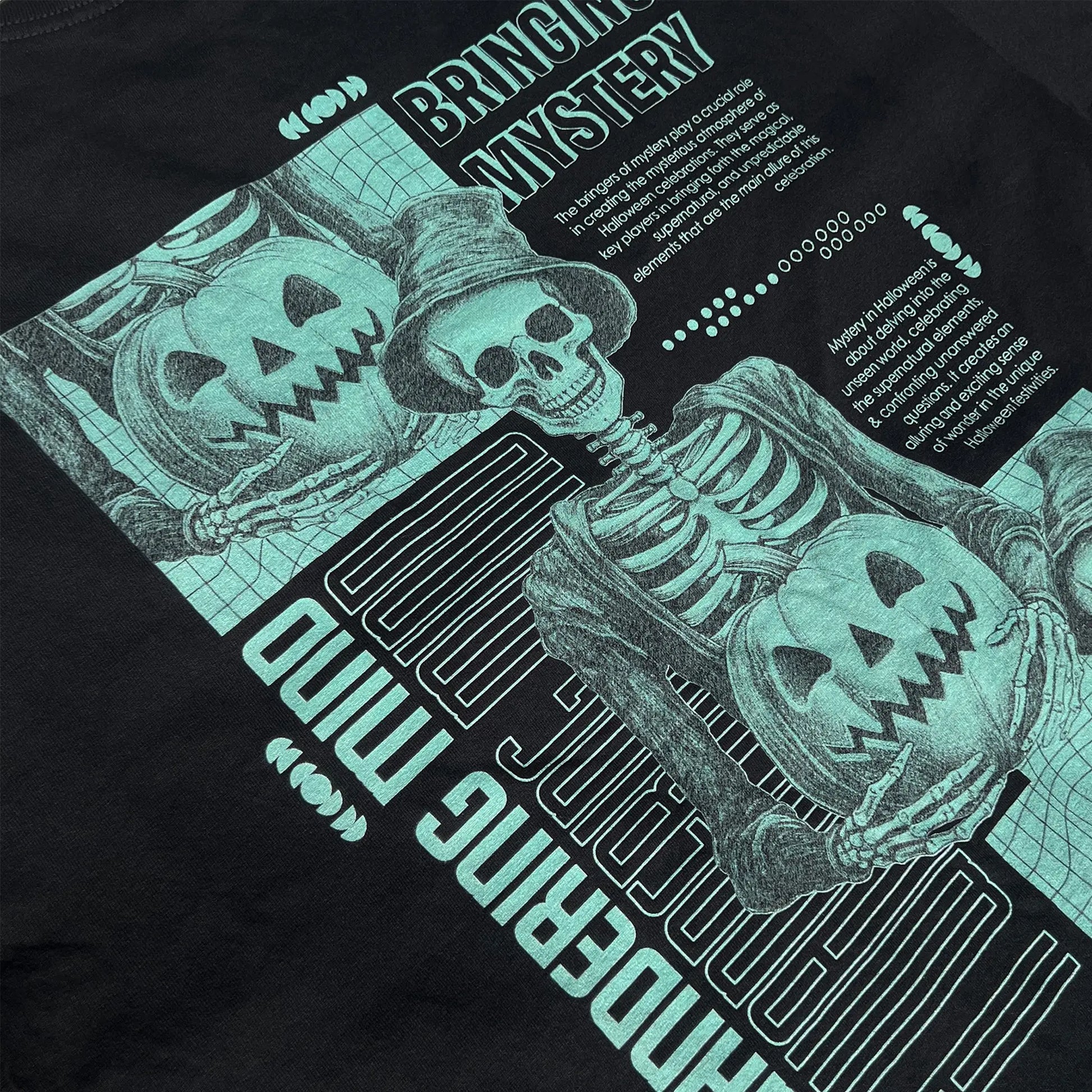 A Wandering Mind Bringing Mystery t-shirt in black back graphic angled view of skeletal figure, jack-o’-lantern, grid layout