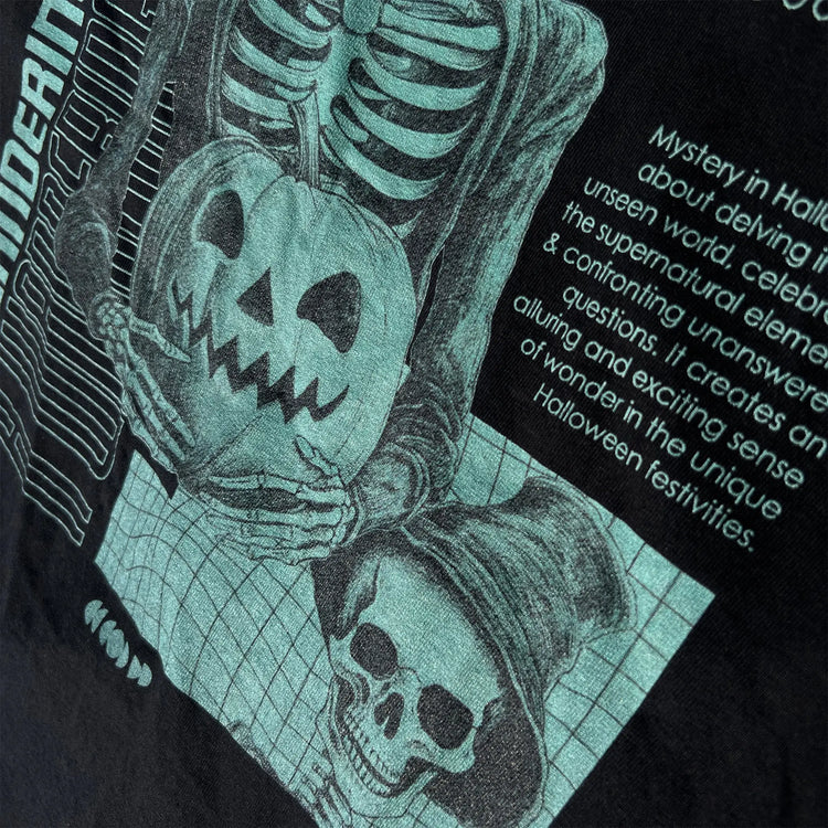 A Wandering Mind Bringing Mystery t-shirt in black back graphic detail showing skeletal figure, jack-o’-lantern, grid layout