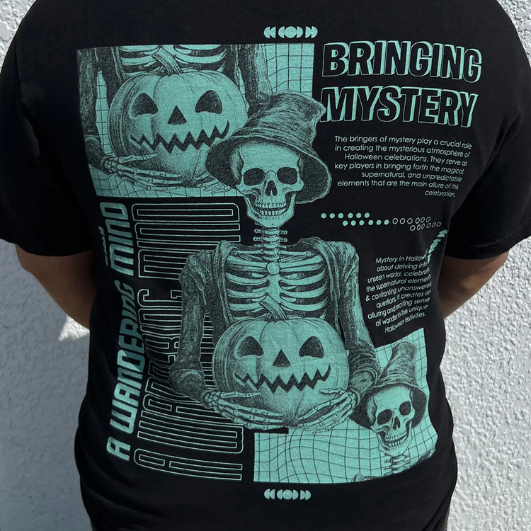 A Wandering Mind Bringing Mystery t-shirt in black back view worn on model