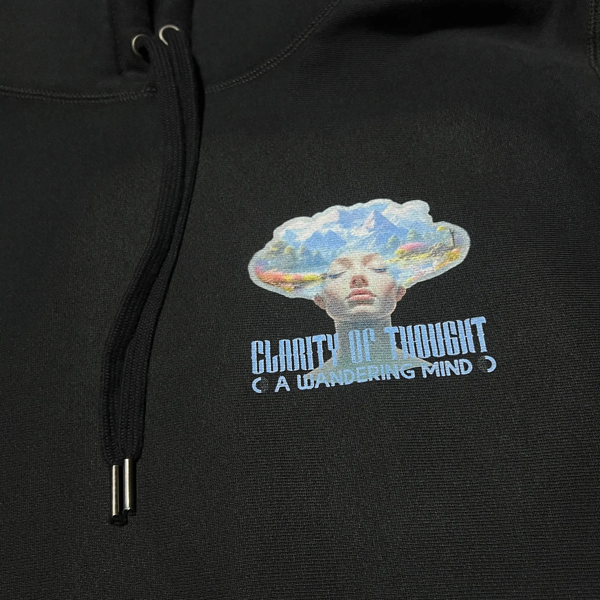 A Wandering Mind Clarity of Thought hoodie in black front graphic detail print texture showing human profile, mountains, lake
