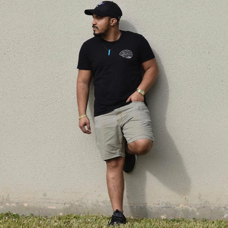 A Wandering Mind Classic Brain White Logo t-shirt in black front view worn on model