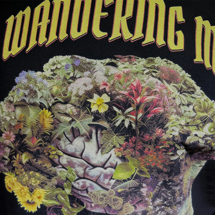 A Wandering Mind Cognitive Flora long sleeve t-shirt in black front graphic detail showing human profile, floral brain