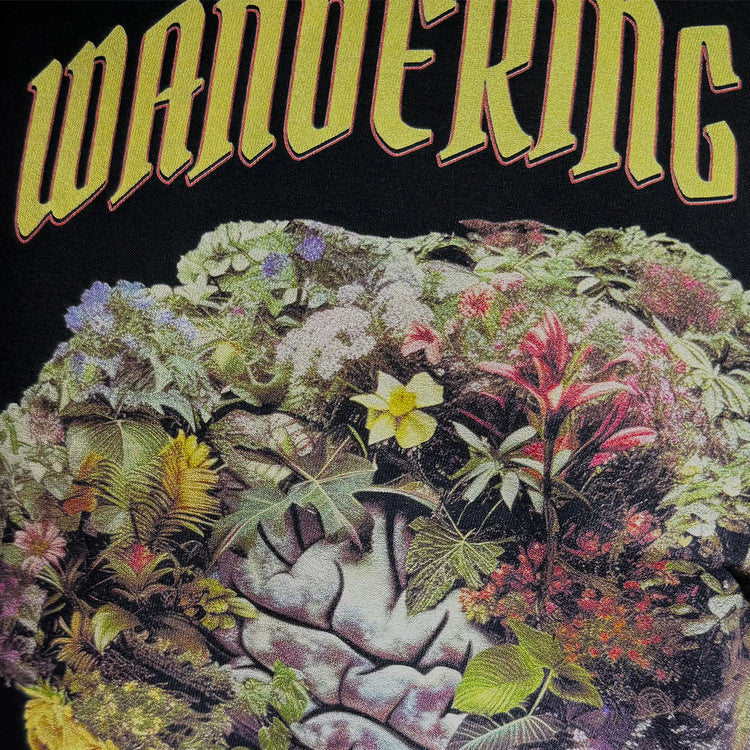 A Wandering Mind Cognitive Flora t-shirt in black front graphic detail showing human profile, floral brain
