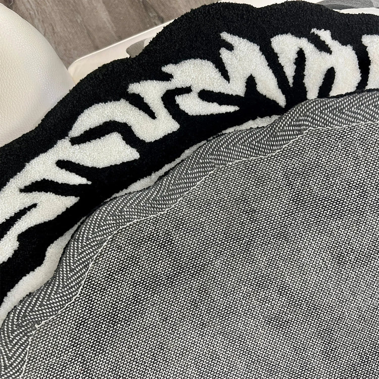 A Wandering Mind Divided Self rug in black and white edge detail