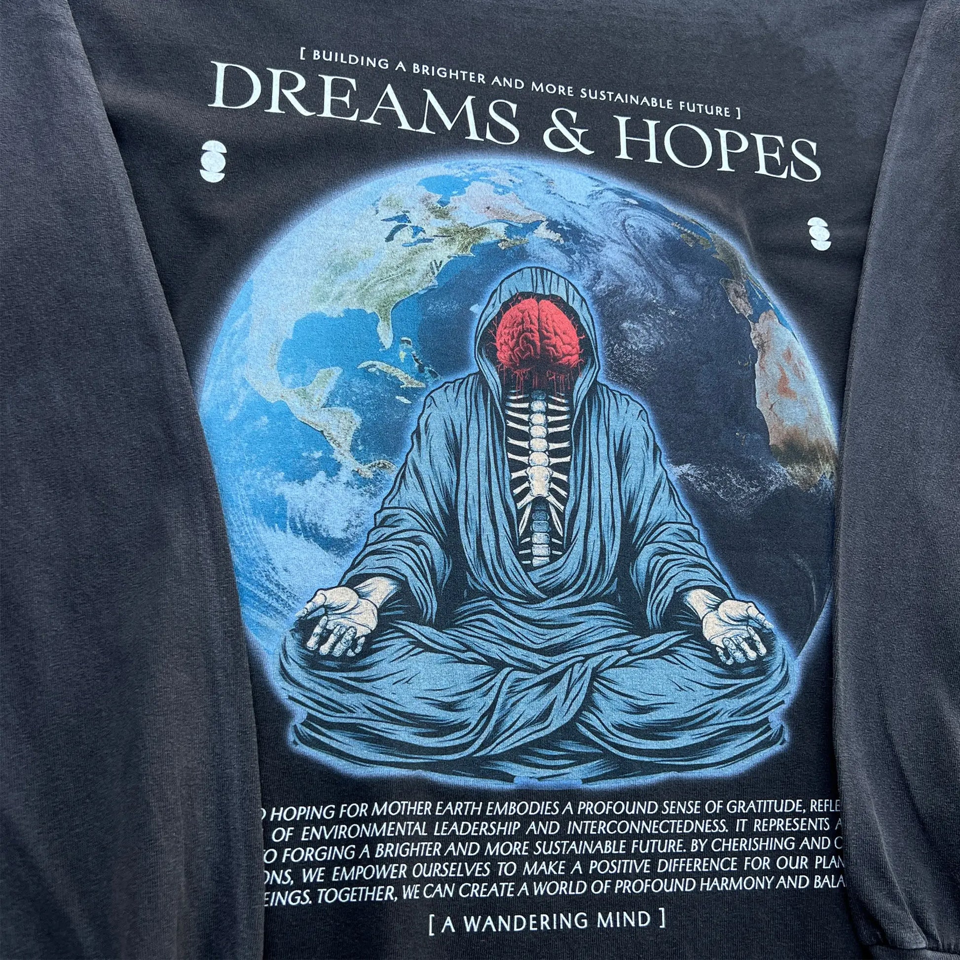 A Wandering Mind Dreams and Hopes long sleeve t-shirt in vintage black front graphic angled view of robed figure, exposed brain, globe