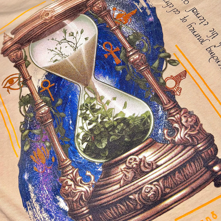 A Wandering Mind Growth & Renewal t-shirt in sand back graphic detail showing hourglass, foliage, symbolic elements