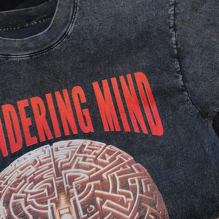 A Wandering Mind Mindful Maze t-shirt in washed black front graphic detail showing human head maze, staircase