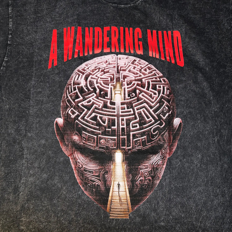 A Wandering Mind Mindful Maze t-shirt in washed black front graphic detail showing human head maze, staircase