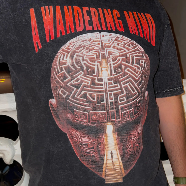 A Wandering Mind Mindful Maze t-shirt in washed black side view worn on model