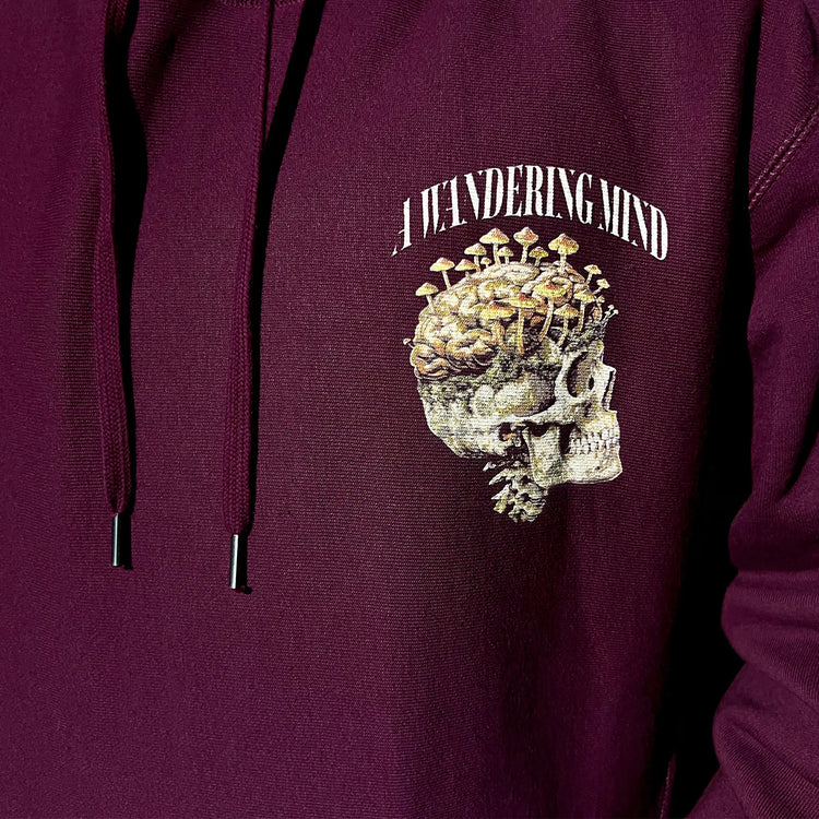 A Wandering Mind Rebirth hoodie in maroon front graphic detail print texture showing skull, mushrooms, moss