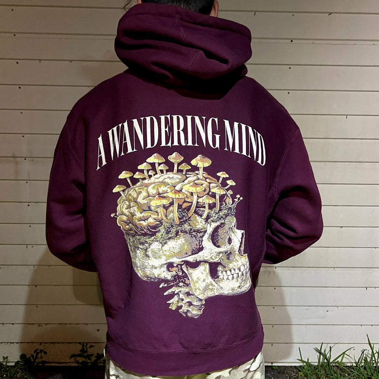A Wandering Mind Rebirth hoodie in maroon back view worn on model