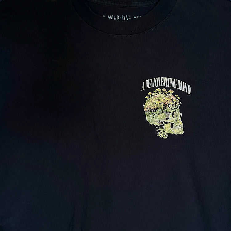 A Wandering Mind Rebirth t-shirt in black front graphic detail showing skull, mushrooms, moss