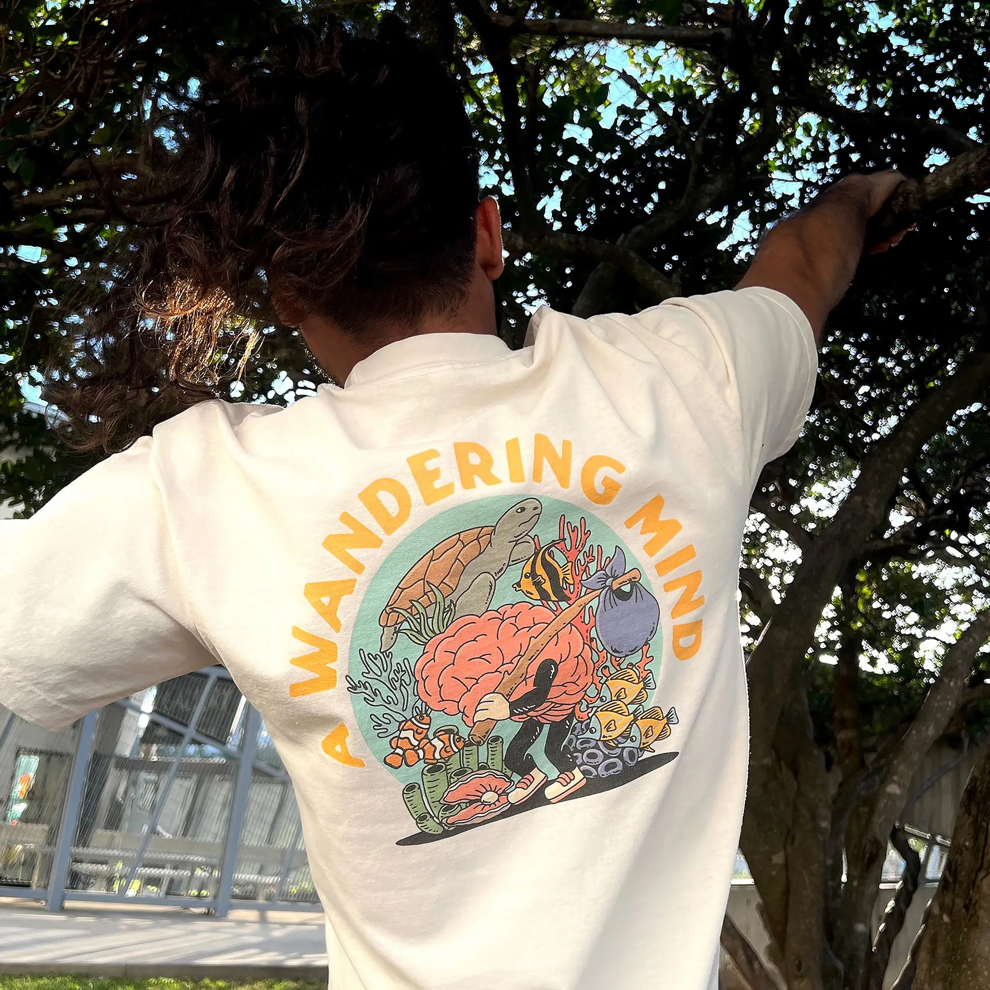 A Wandering Mind Sunken Thoughts t-shirt in bone back view worn on model