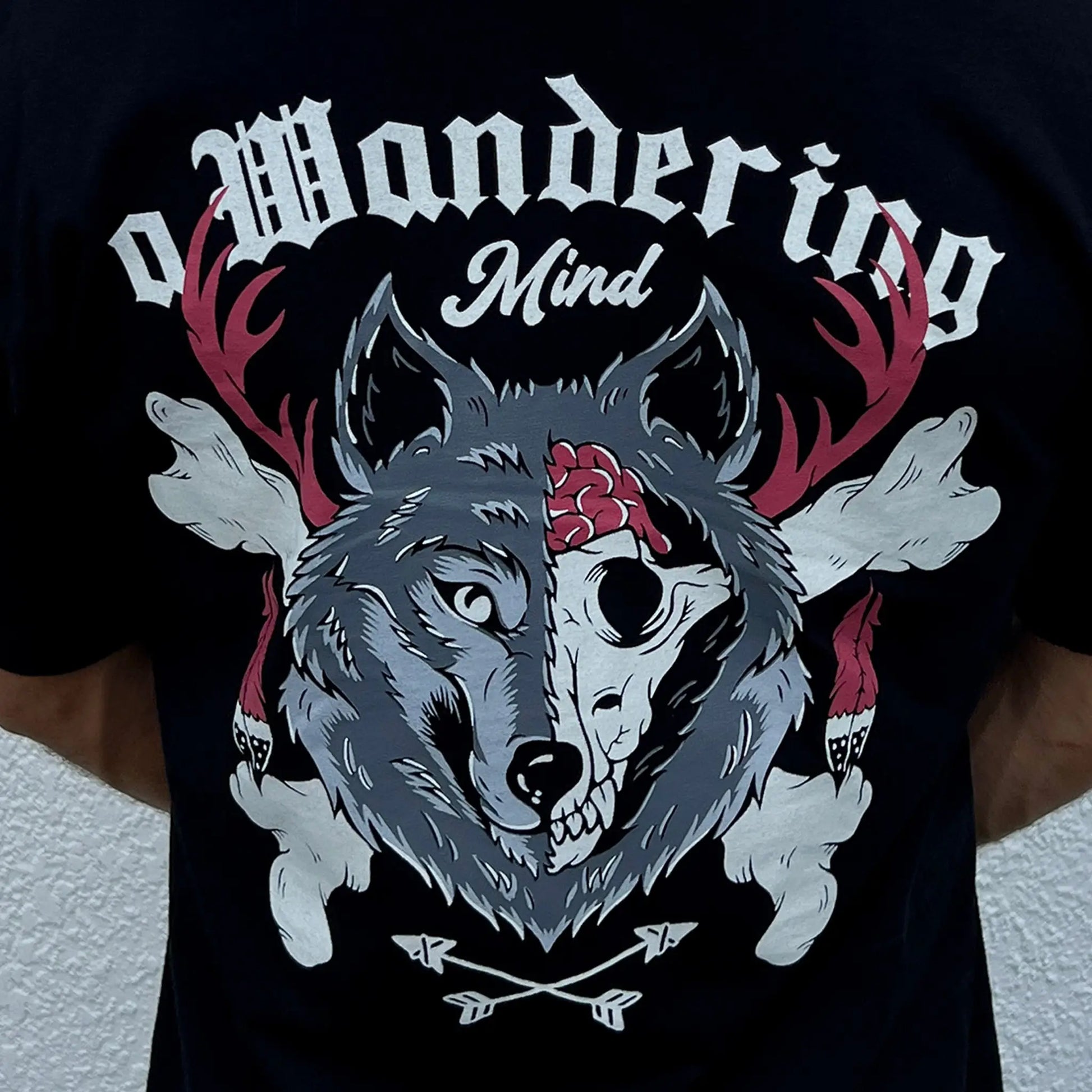 A Wandering Mind The Wolf t-shirt in black back view worn on model