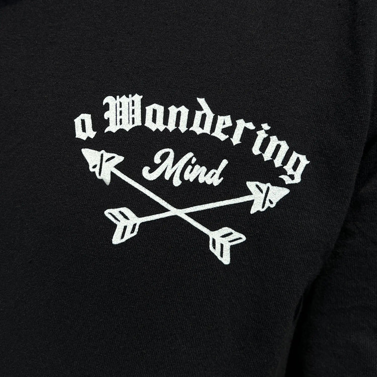 A Wandering Mind The Wolf t-shirt in black front view worn on model