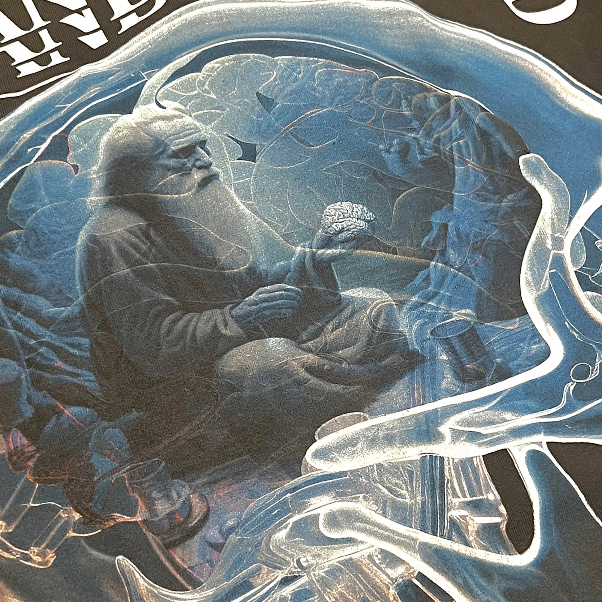 A Wandering Mind Warden of Thought long sleeve t-shirt in vintage black front skull with seated figure, typography