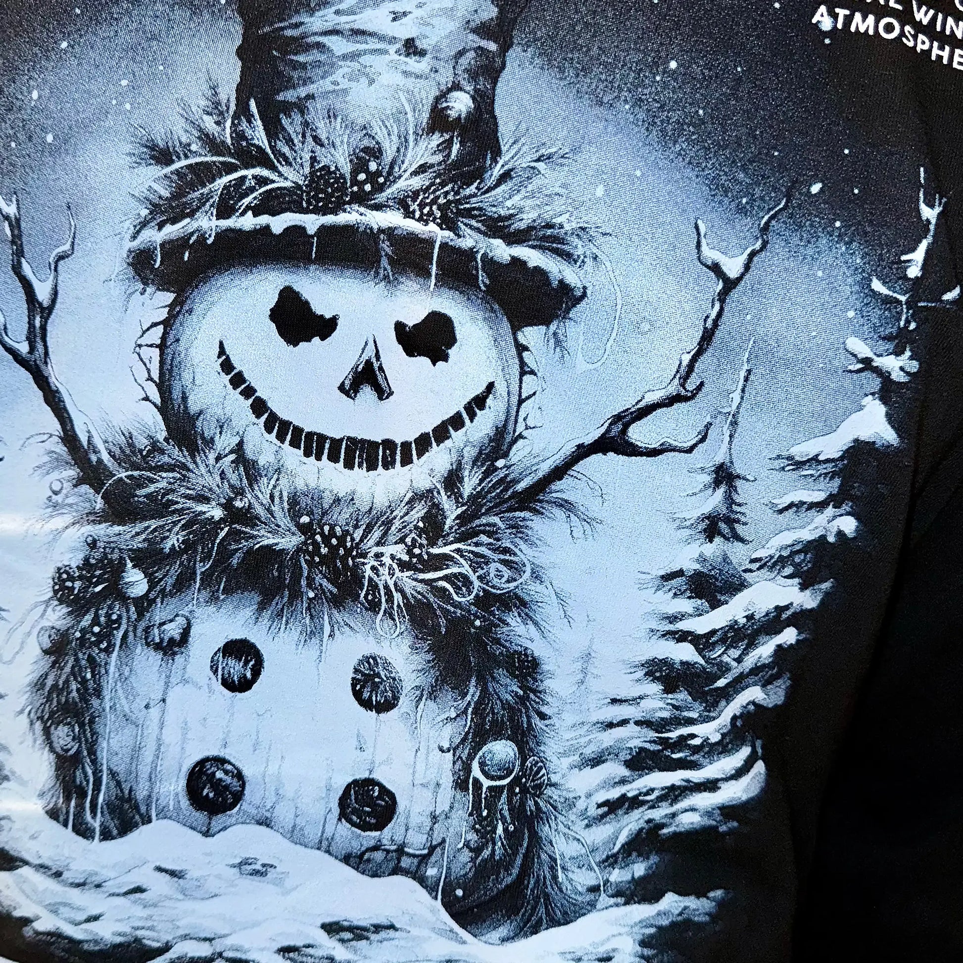 A Wandering Mind Winter Wonderland t-shirt in black back graphic detail showing snowman with smiling face, winter elements